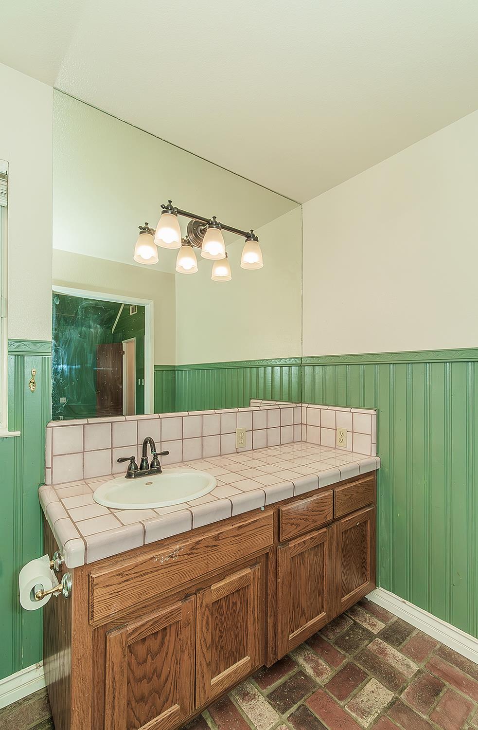 15501 Garlock Lane Prather, CA 93651 - Photo 18 of 47 a bathroom with a sink and a mirror