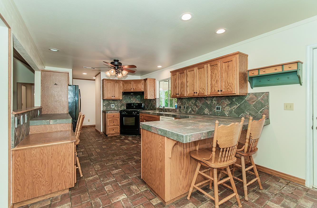 15501 Garlock Lane Prather, CA 93651 - Photo 10 of 47 a kitchen with a sink and cabinets