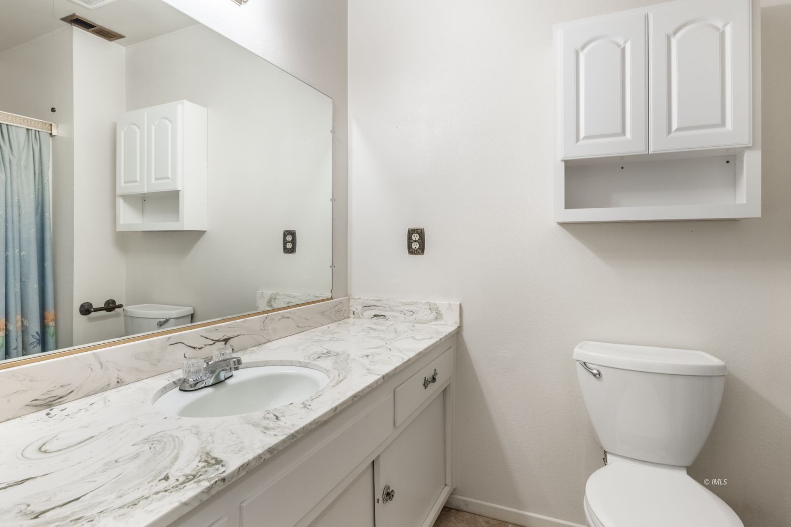 1424 Rocking W Drive Bishop, CA 93514 - Photo 14 of 27 a bathroom with a granite countertop toilet sink and mirror