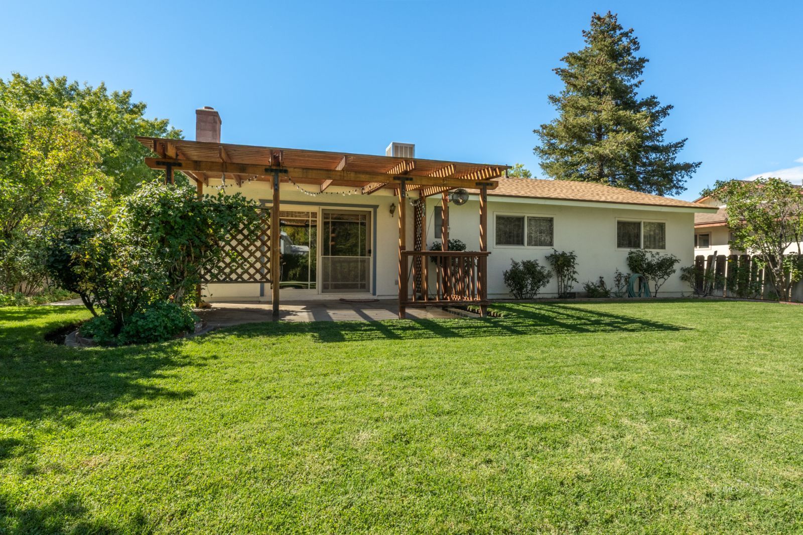 1424 Rocking W Drive Bishop, CA 93514 - Photo 17 of 27 a front view of house with yard and green space