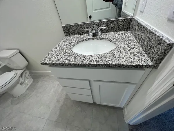 a bathroom with a toilet and bathtub