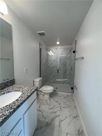 a bathroom with a sink a vanity and a mirror
