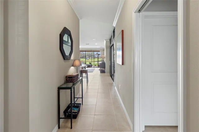 a kitchen with granite countertop a table chairs microwave and cabinets