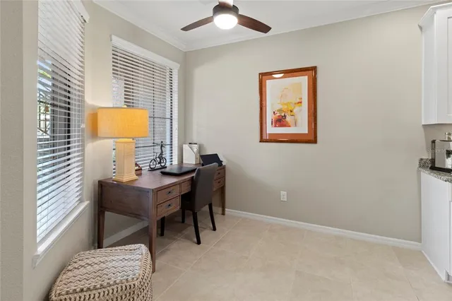 a view of a livingroom and a dining room with furniture window and wooden floor