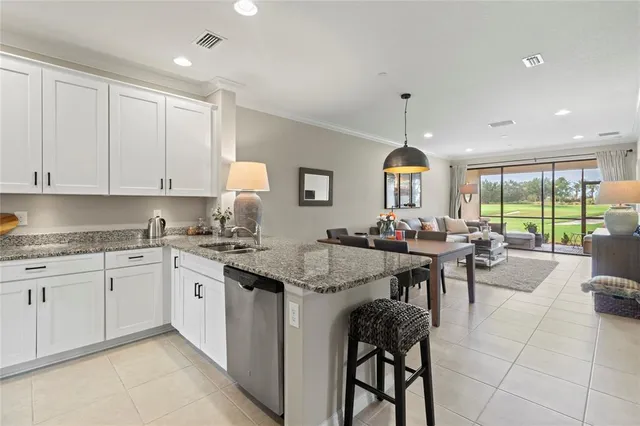 a living room with patio furniture and a window