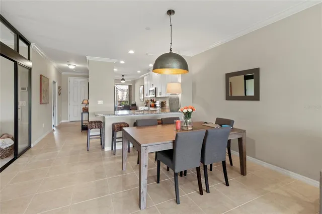 a living room with furniture a flat screen tv and a large window