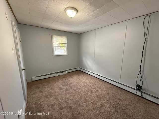 an empty room with a empty space and window