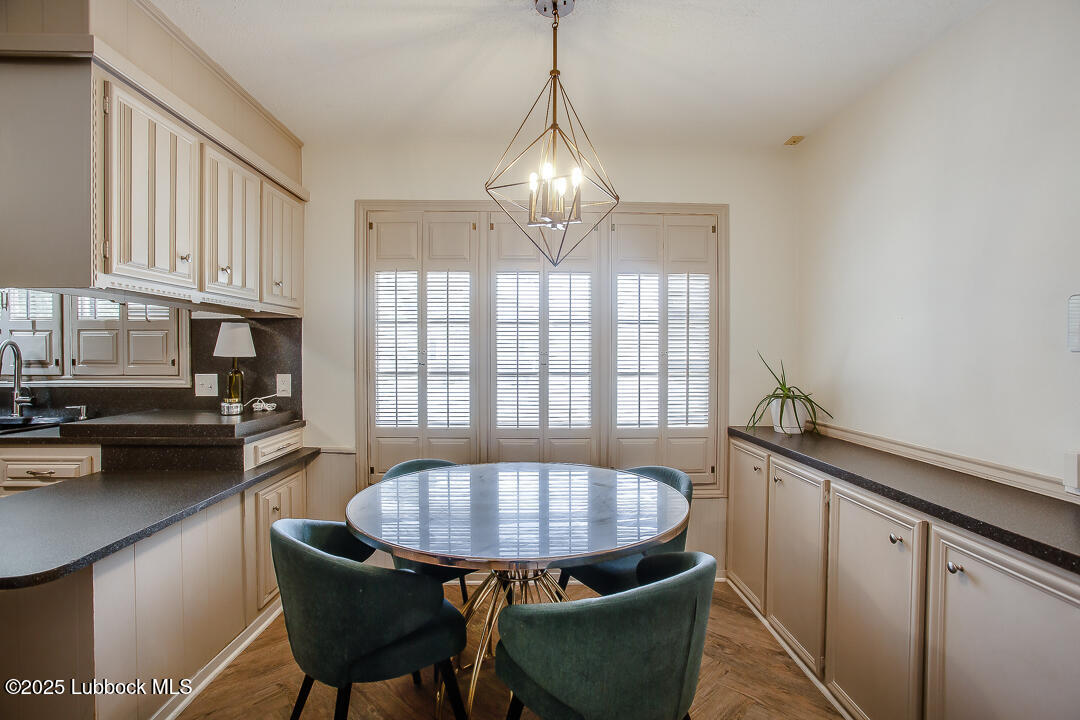 2912 76th Street Lubbock, TX 79423 - Photo 14 of 34 a view of a dining room with furniture window and outside view