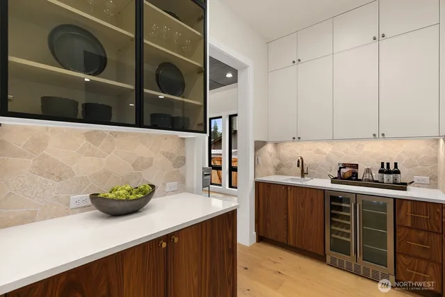 a kitchen with stainless steel appliances a sink a stove and cabinets