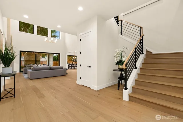 a view of entryway and hall with wooden floor
