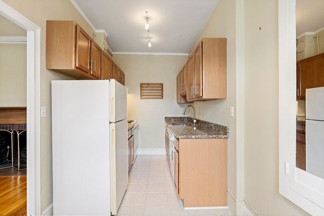 a utility room with refrigerator washer and dryer