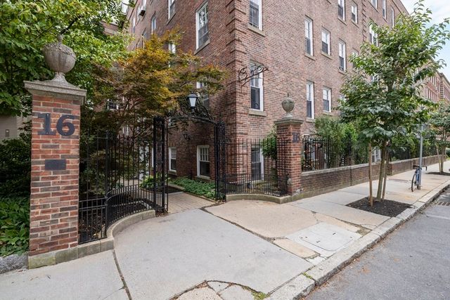 a view of a building with potted plants