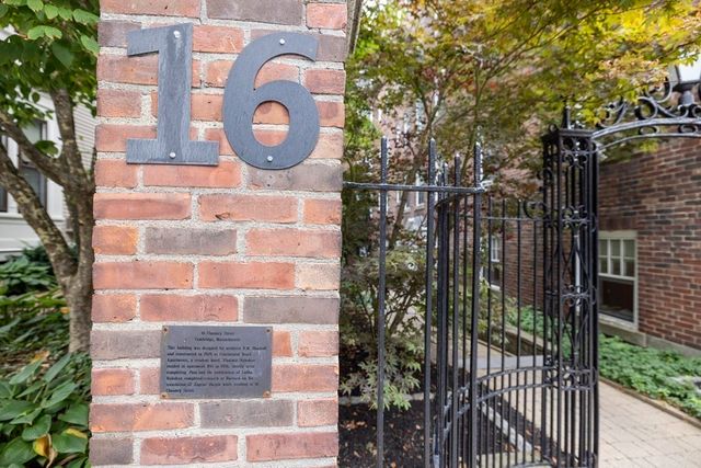 a view of a door and brick wall