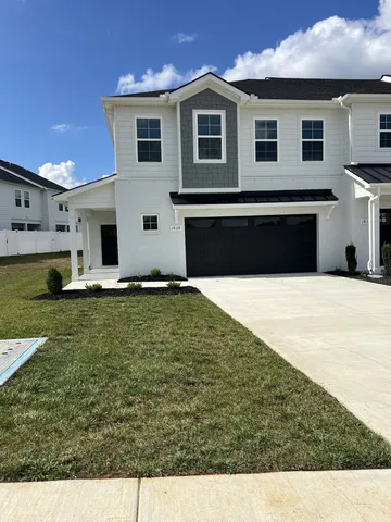 a swimming pool with outdoor seating and yard