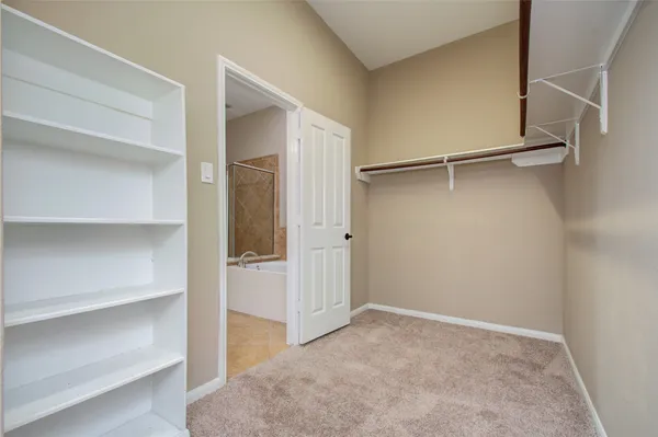 a view of an empty walk in closet