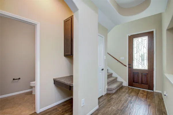 a view of entryway with stairs and wooden floor