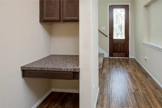 a hallway with wooden floor