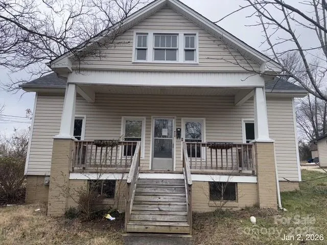 a front view of a house with stairs