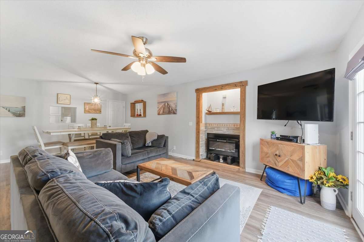1000 Sea Island Road, Unit 68 St. Simons, GA 31522 - Photo 8 of 19 Family room with wood burning fireplace