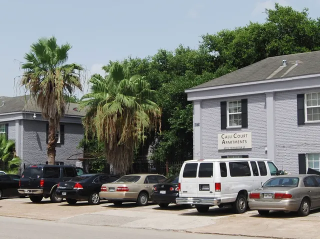 a view of a cars park in front of a house