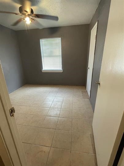 6225 Tierwester Street, Unit 9 Houston, TX 77021 - Photo 6 of 6 a view of an empty room with a window