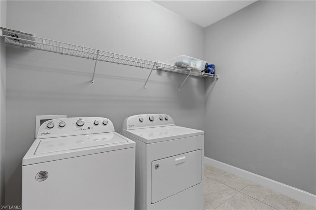 19953 Beverly Park Road Estero, FL 33928 - Photo 23 of 50 Laundry room with baseboards, independent washer and dryer, and laundry area