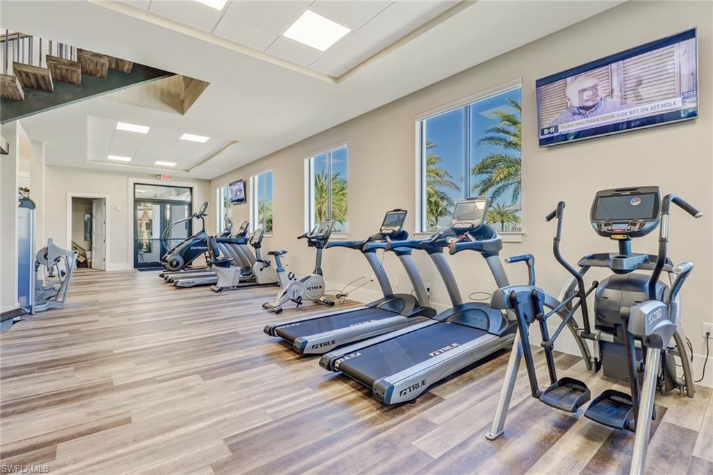 19953 Beverly Park Road Estero, FL 33928 - Photo 36 of 50 Gym featuring light wood-style flooring and baseboards