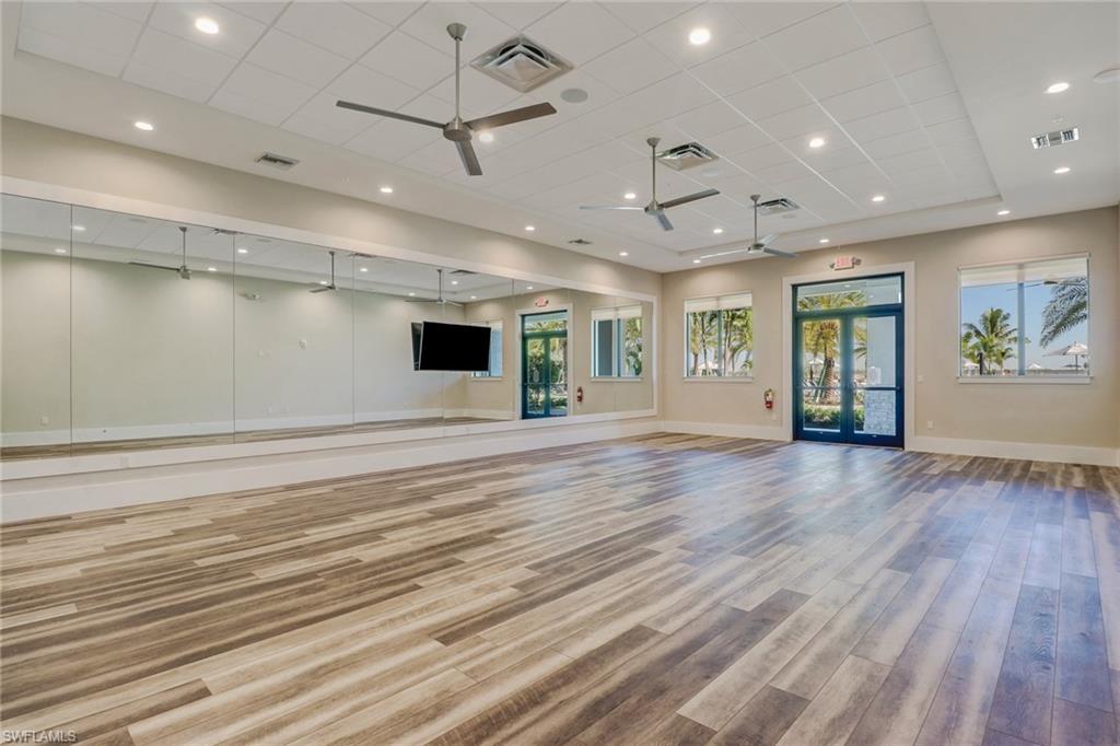 19953 Beverly Park Road Estero, FL 33928 - Photo 42 of 50 Workout room featuring visible vents, a ceiling fan, and wood finished floors