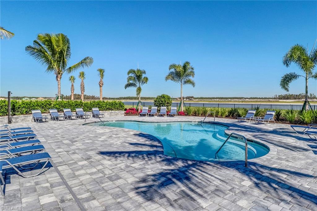 19953 Beverly Park Road Estero, FL 33928 - Photo 49 of 50 Pool with a patio area, a water view, and fence