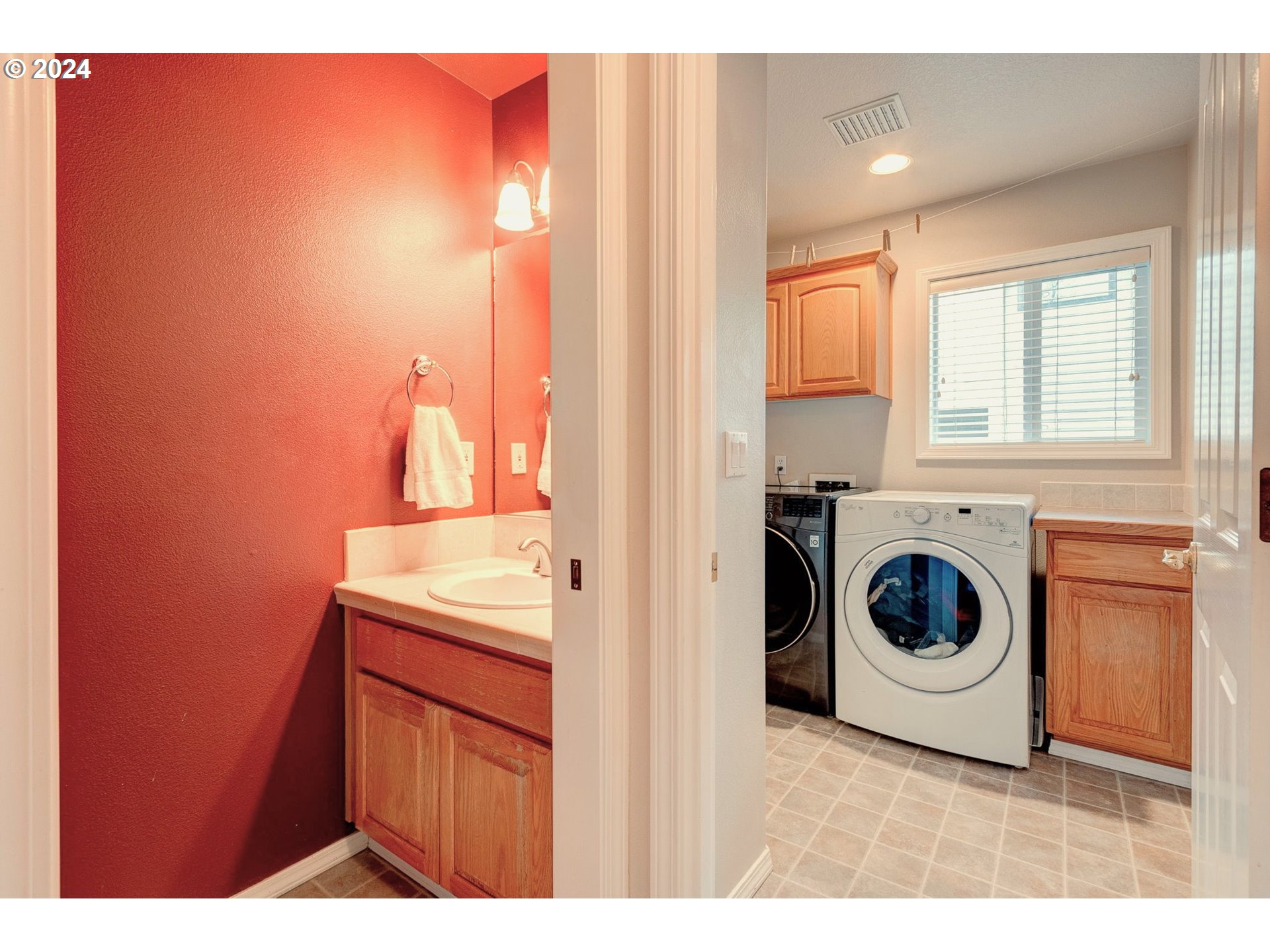 17558 Bryant Road Lake Oswego, OR 97035 - Photo 20 of 48 a view of a kitchen with a sink washer and dryer