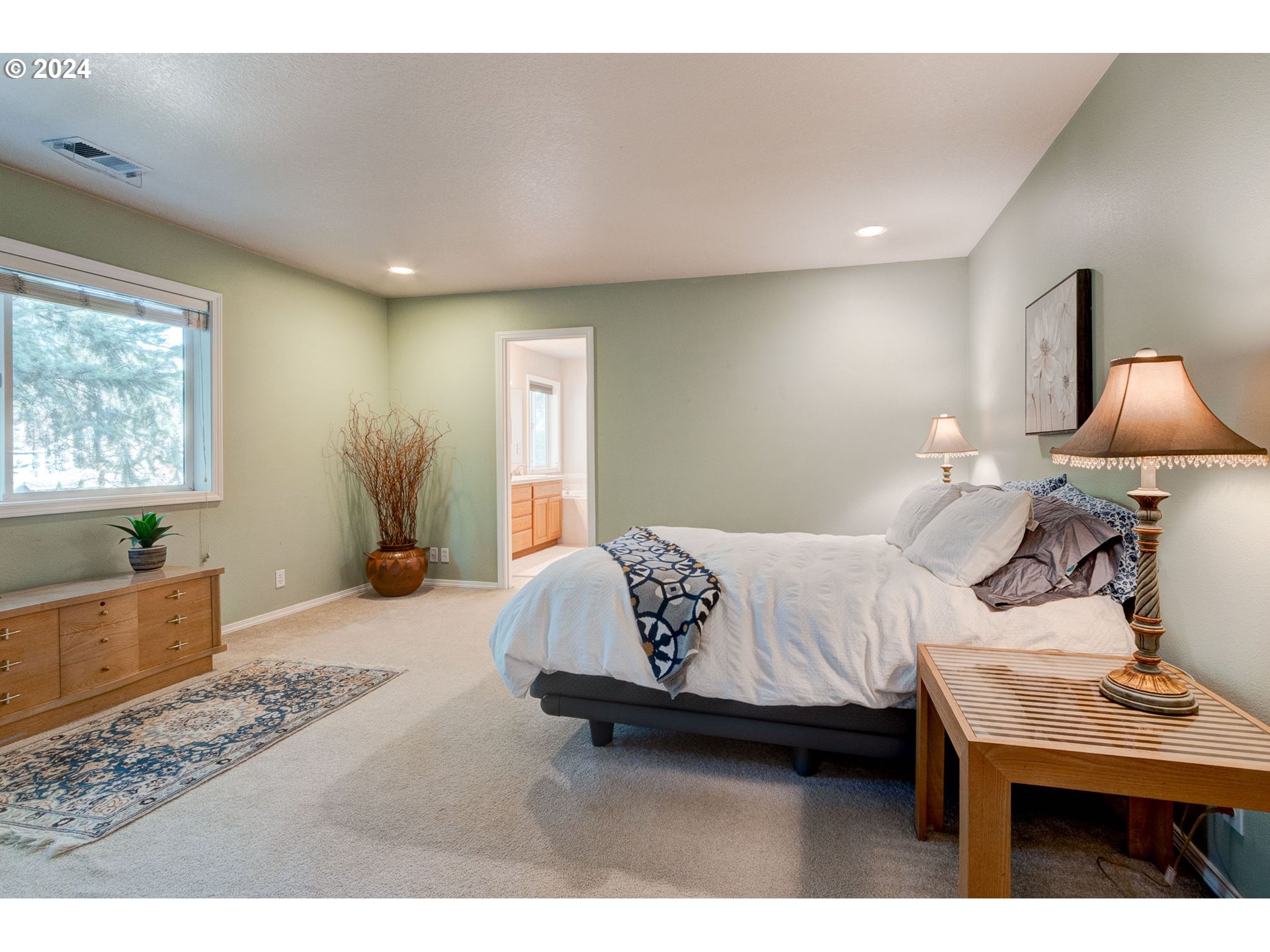 17558 Bryant Road Lake Oswego, OR 97035 - Photo 22 of 48 a living room with a bed furniture and a window