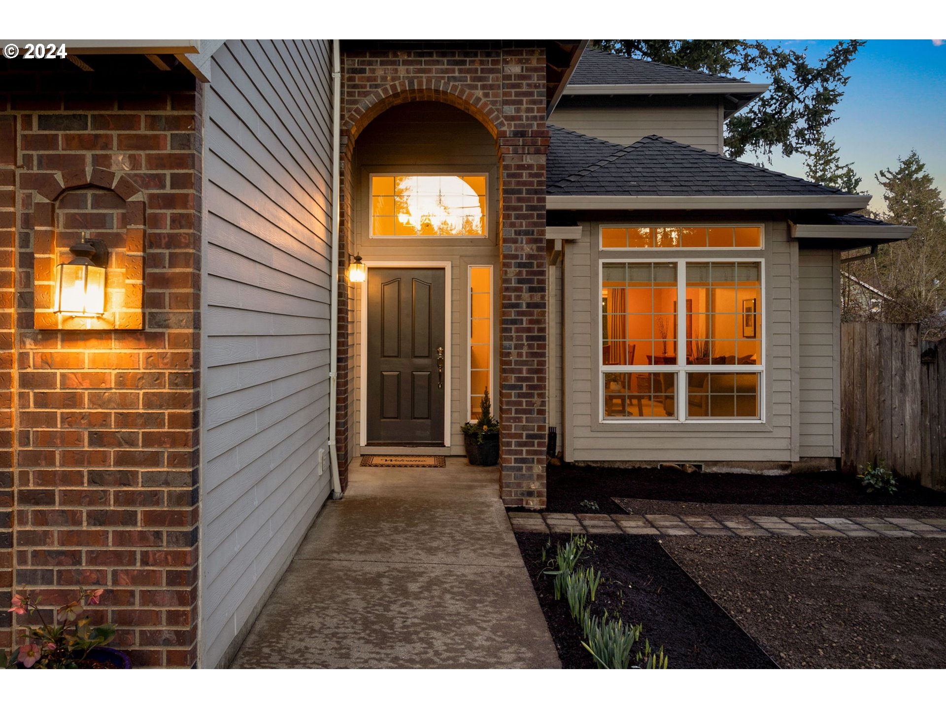 17558 Bryant Road Lake Oswego, OR 97035 - Photo 3 of 48 a view of a brick house with a large door