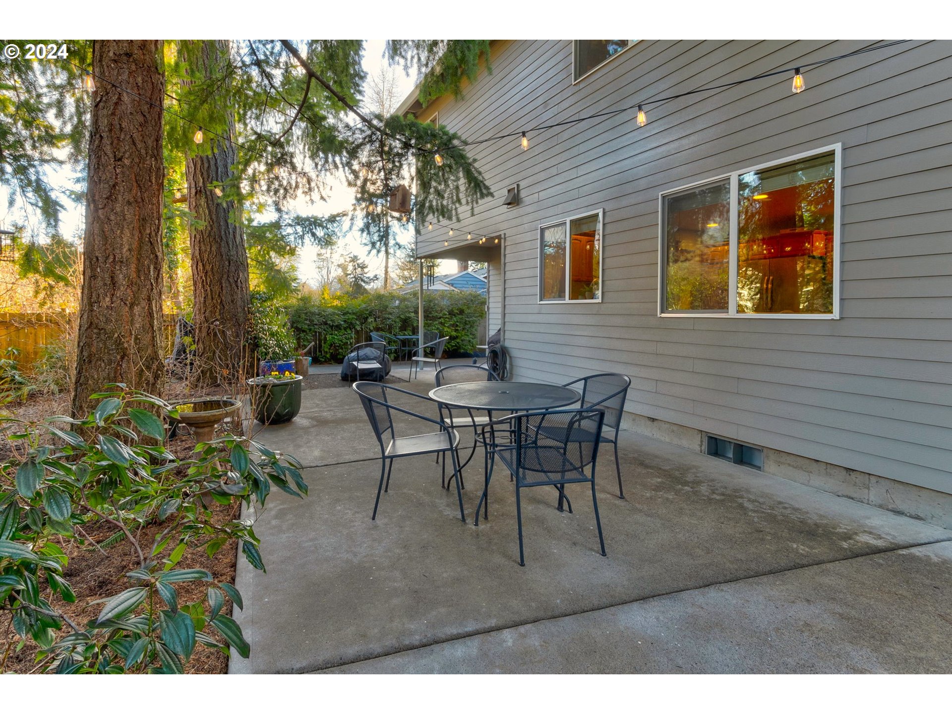 17558 Bryant Road Lake Oswego, OR 97035 - Photo 41 of 48 a view of a patio with table and chairs and potted plants