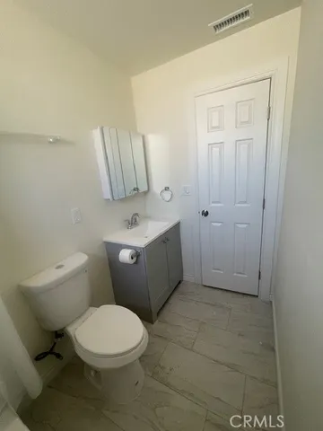 a view of a backyard with sitting area