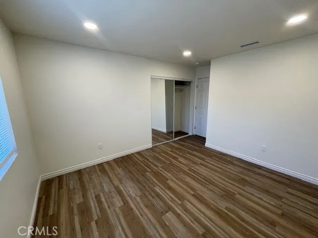 a kitchen with a sink a refrigerator a microwave and cabinets