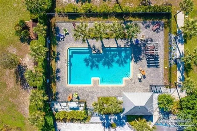 an aerial view of a house with outdoor space and lake view