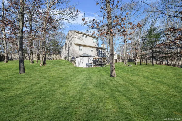 a garden with trees in the background