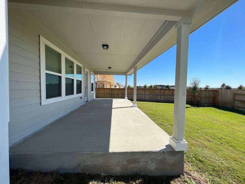 105 Spiny Lizard Lane San Marcos, TX 78666 - Photo 23 of 34 Fenced backyard with a patio