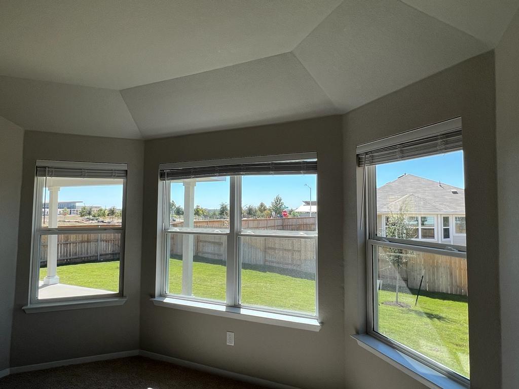 105 Spiny Lizard Lane San Marcos, TX 78666 - Photo 7 of 34 Unfurnished sunroom featuring healthy amount of natural light and vaulted ceiling