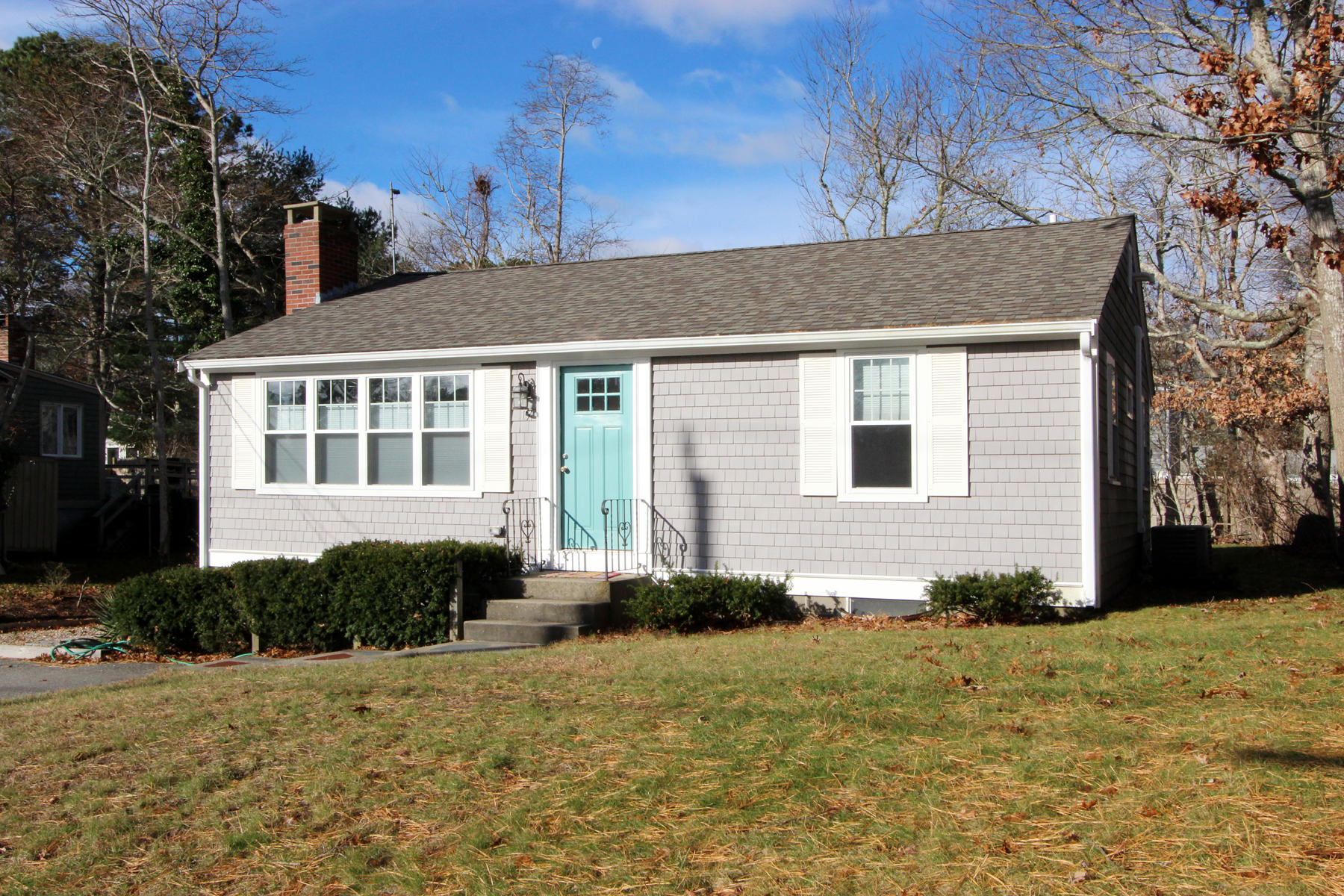17 Bearse Road Mashpee, MA 02649 - Photo 3 of 24 a front view of a house with a yard
