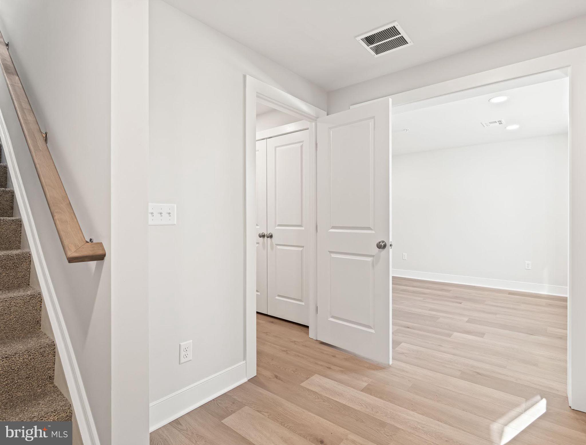 4129 Ridgeview Avenue Mechanicsburg, PA 17055 - Photo 17 of 59 a view of a hallway with wooden floor and staircase