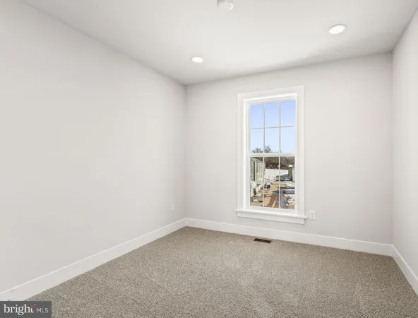 an empty room with closet area