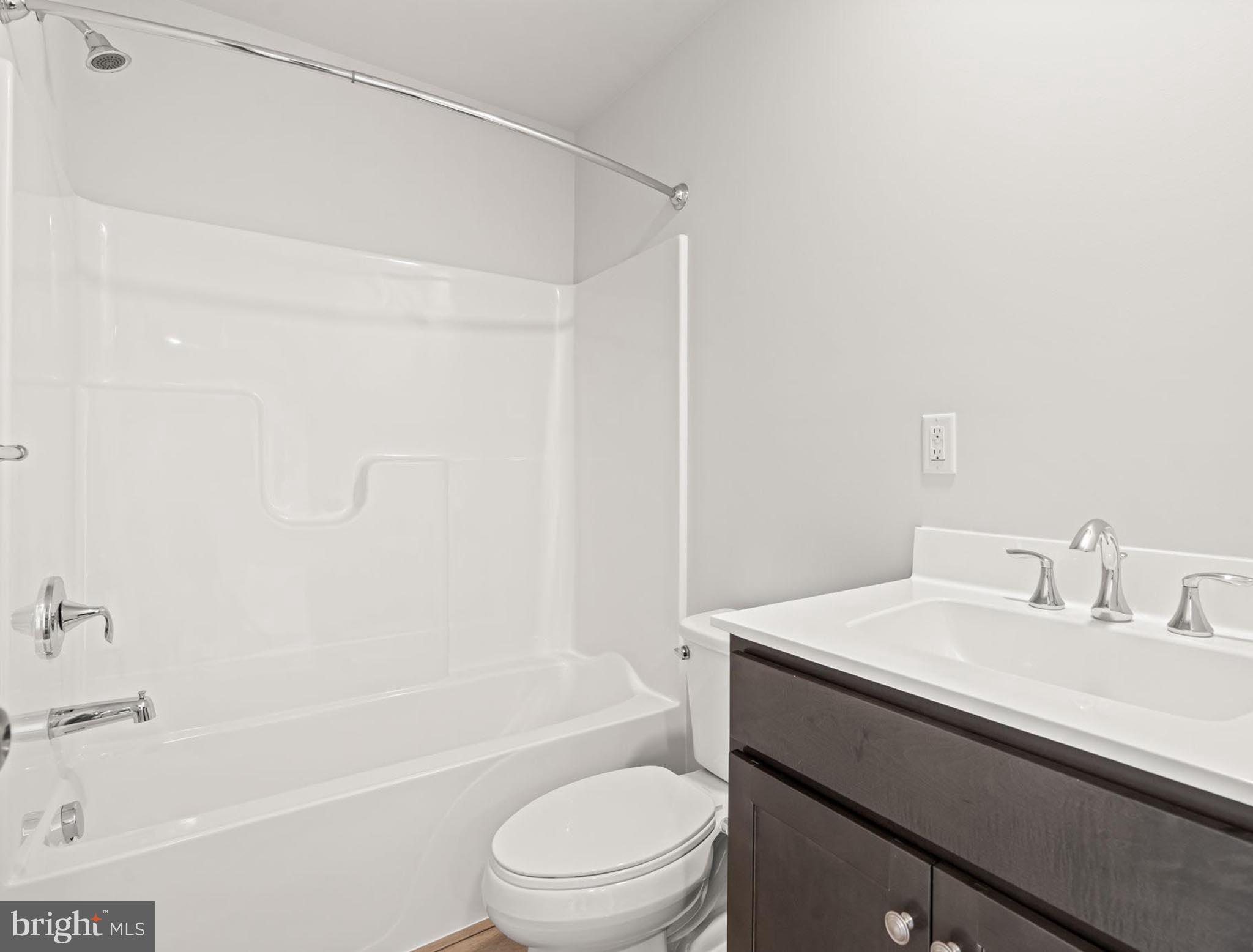 4129 Ridgeview Avenue Mechanicsburg, PA 17055 - Photo 25 of 59 a bathroom with a sink a toilet and shower