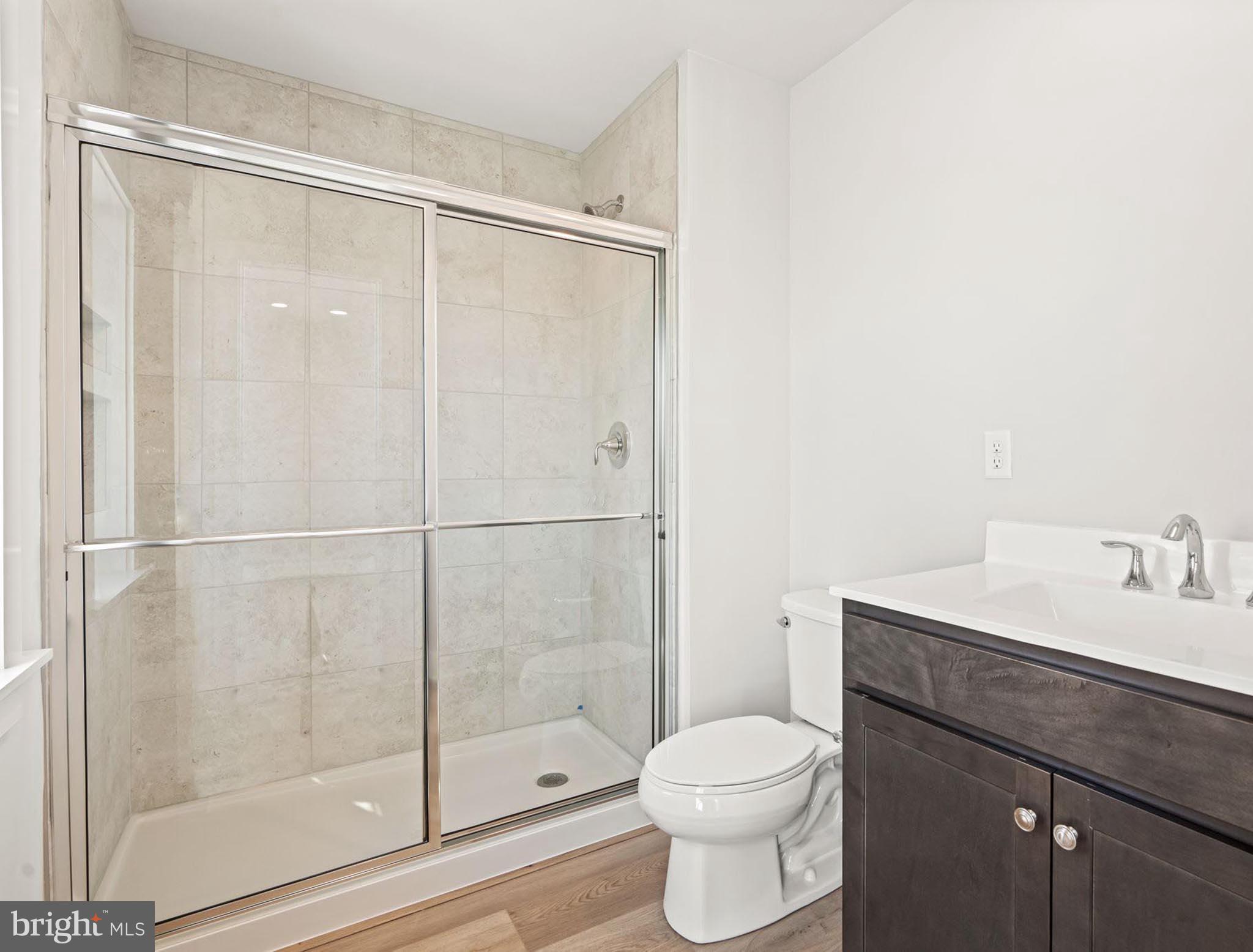 4129 Ridgeview Avenue Mechanicsburg, PA 17055 - Photo 29 of 59 a bathroom with a sink toilet and shower