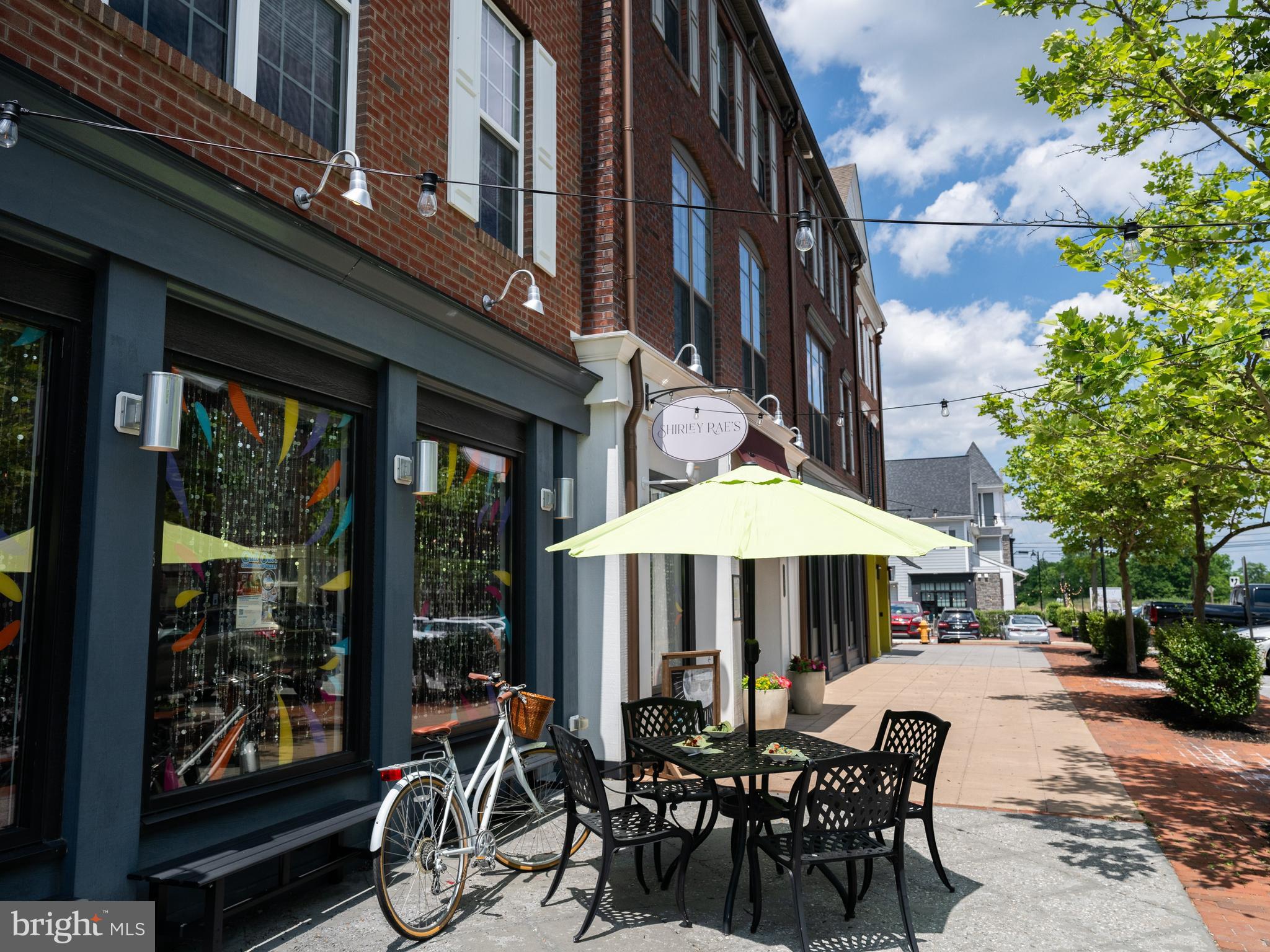 4129 Ridgeview Avenue Mechanicsburg, PA 17055 - Photo 42 of 59 a couple of table and chairs under an umbrella in front of building