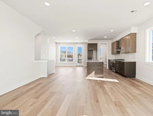 a view of a kitchen with microwave and cabinets