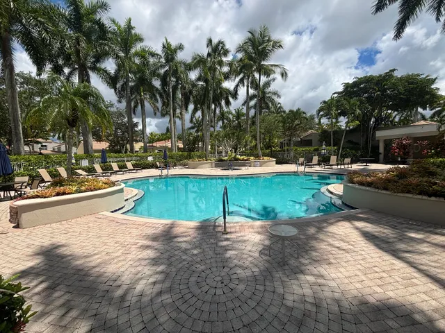 a view of a swimming pool with a patio