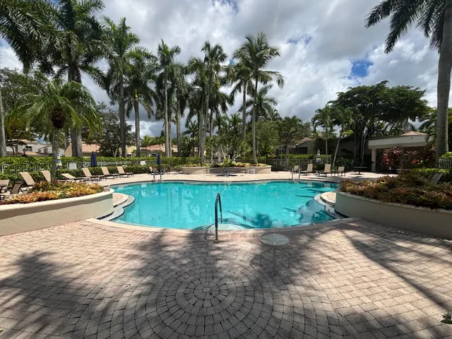 a view of a swimming pool with a patio