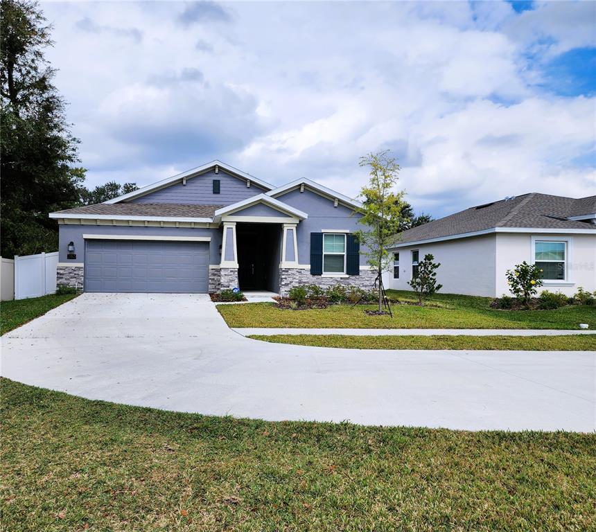 a front view of a house with a swimming pool