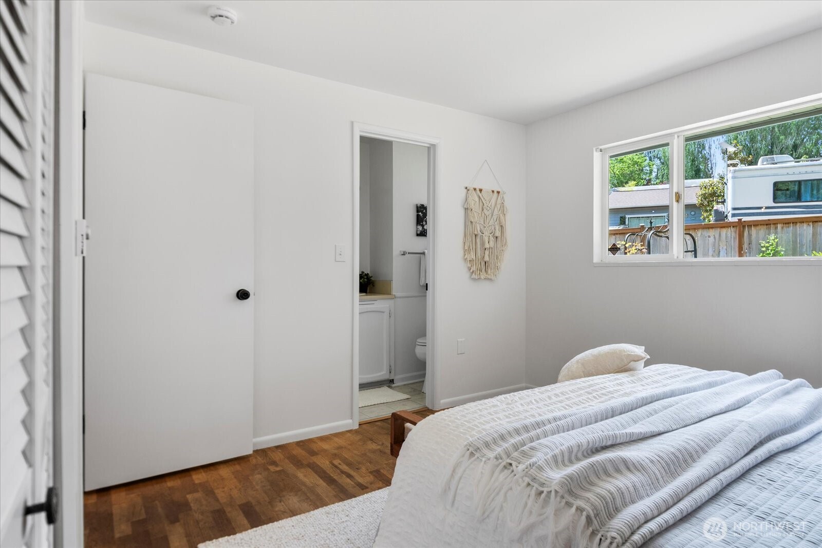 23908 80th Place West Edmonds, WA 98026 - Photo 14 of 40 a bedroom with a bed and a window with outer view